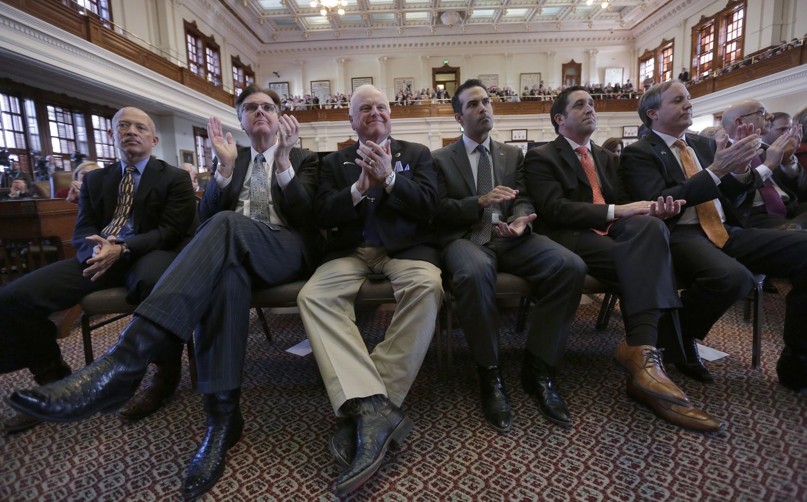 Texas Lt. Gov.-elect Dan Patrick, second from left, Agriculture Commissioner Sid Miller,...