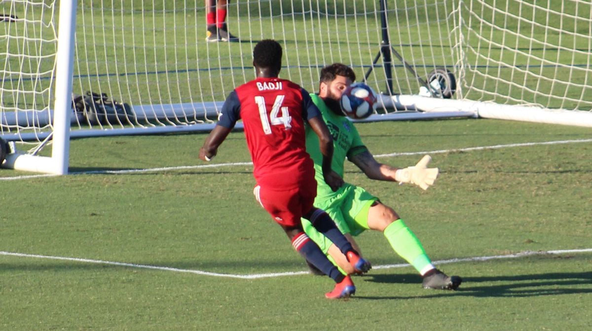 Dominic Badji's attempt on goal is denied by OKC Energy goalkeeper Cody Laurendi. (6-12-19)