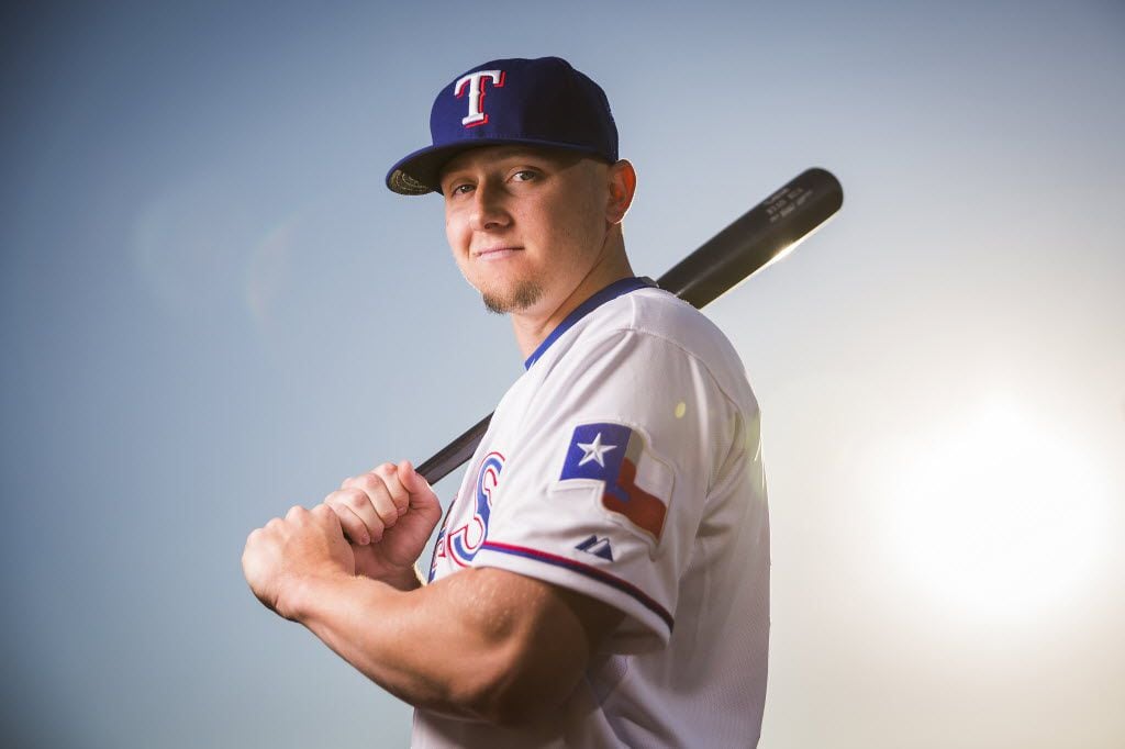 Texas Rangers outfielder Ryan Rua photographed during spring training photo day at the...