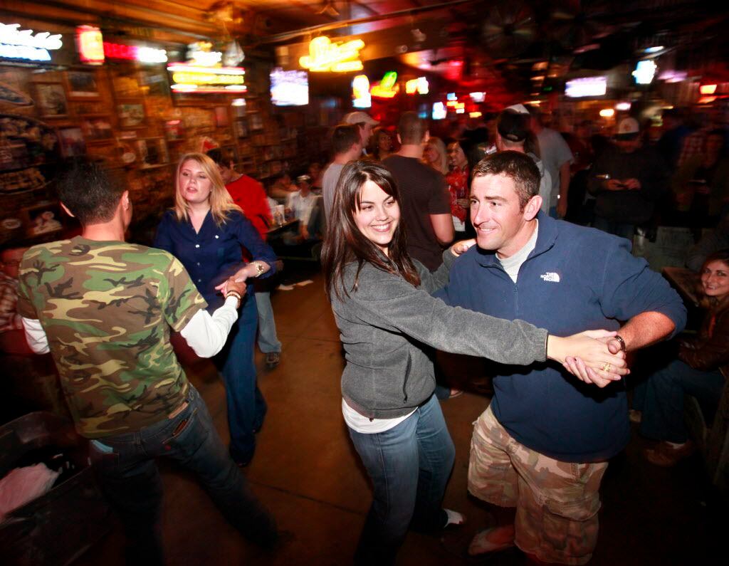 Guests drink and dance at Adair's Saloon.