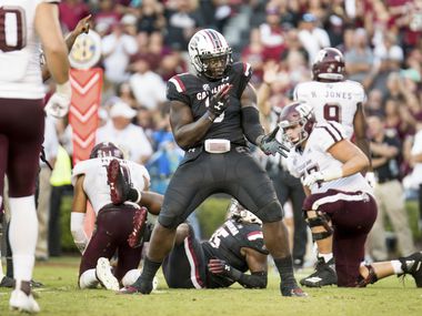 FILE - South Carolina defensive lineman Javon Kinlaw (3) celebrates a play during the second half of a game against Texas A&M on Saturday, Oct. 13, 2018, in Columbia, S.C.