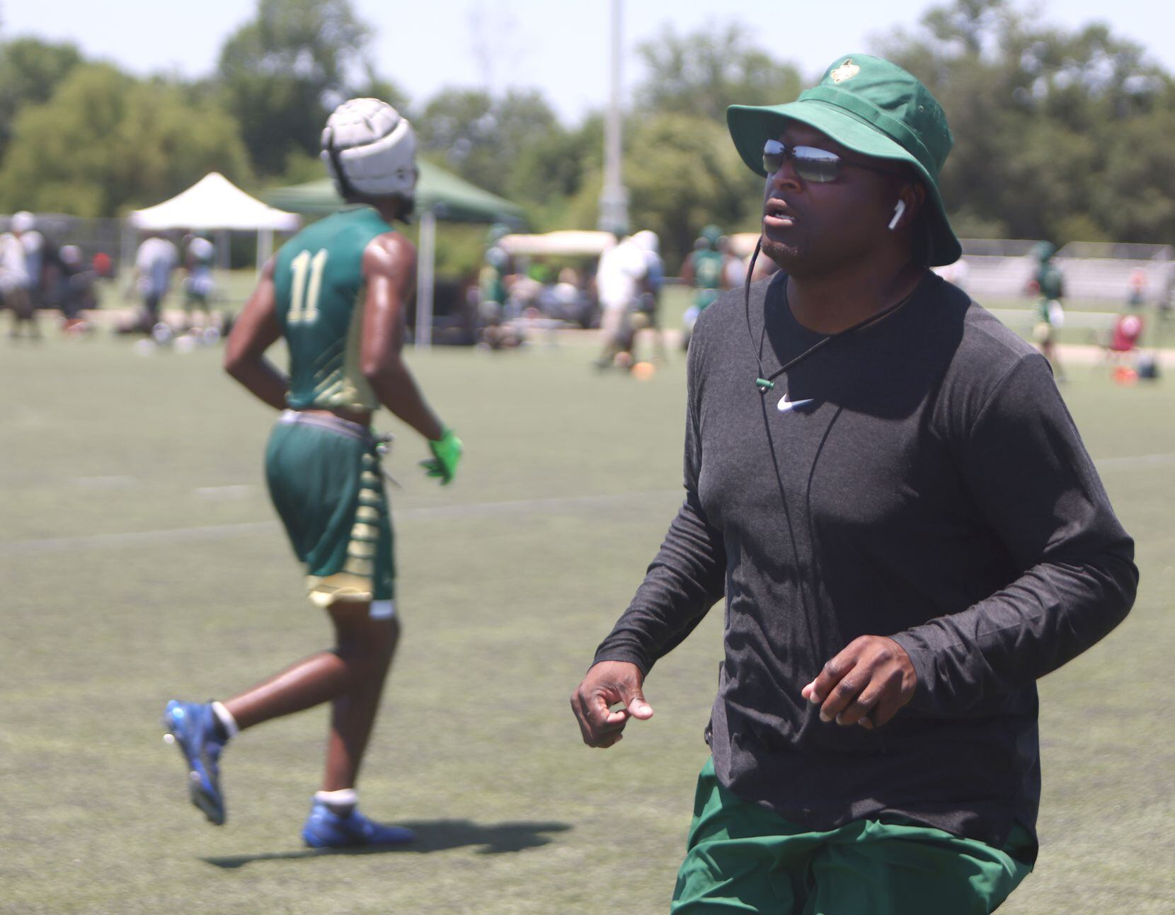 DeSoto head coach Claude Mathis races to the aid of his son Caimon Mathis (2), suffering...