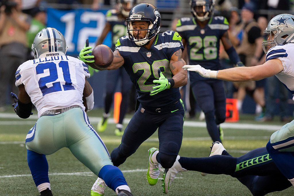 Seattle Seahawks defensive back Earl Thomas (29) intercepts a pass off the hands Dallas...