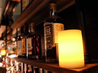 Liquor on the wall behind the bar at Revelers Hall in Bishop Arts neighborhood in Dallas on...
