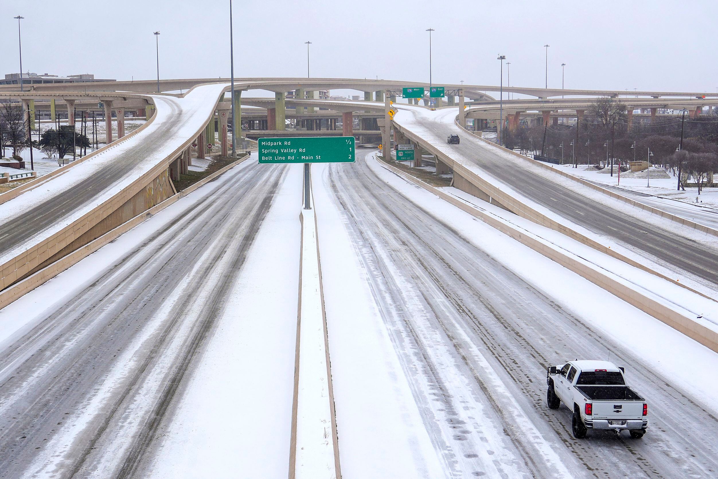 Sparse traffic moves through the High Five Interchange on US 75 as winter storm moves into...