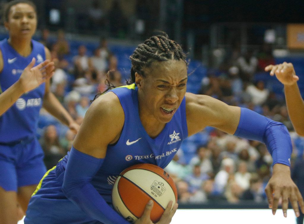 Dallas Wings forward Kayla Thornton (6) lunges to pull in an offensive rebound during second...