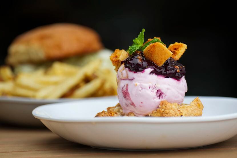Birdie’s Biscuit dessert — a honey biscuit, strawberry ice cream, brambleberry jam and...