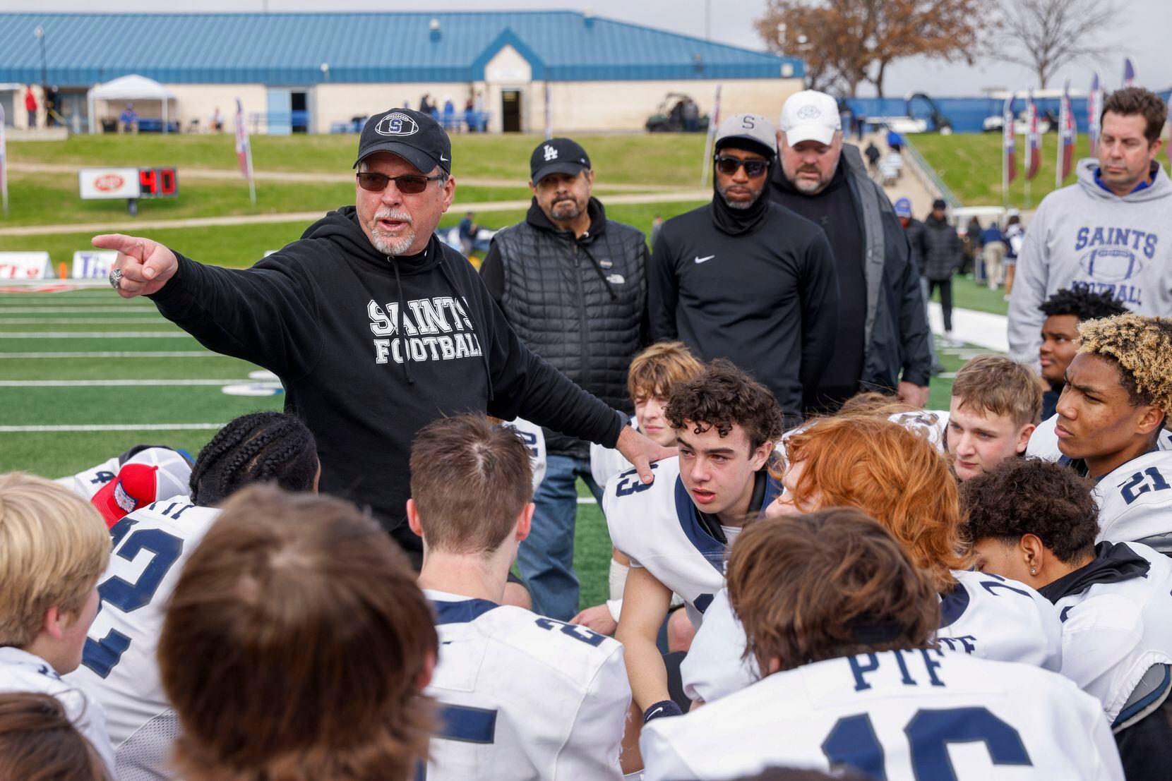 Fort Worth All Saints head coach Aaron Beck speaks to the team after losing the TAPPS...