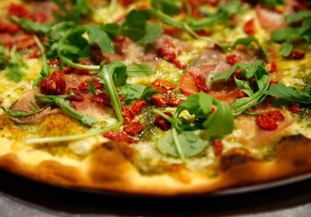 Pesto Sciutto Pizza is made fresh by pizza slayers at Greenville Avenue Pizza Company...