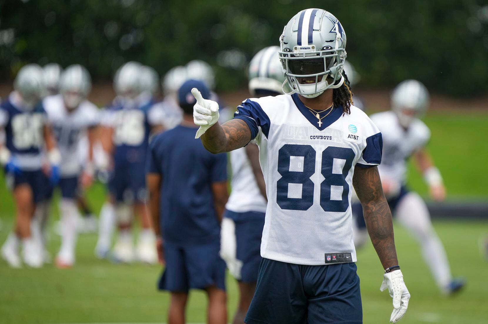 Dallas Cowboys wide receiver CeeDee Lamb (88) points toward the sidelines during a minicamp...