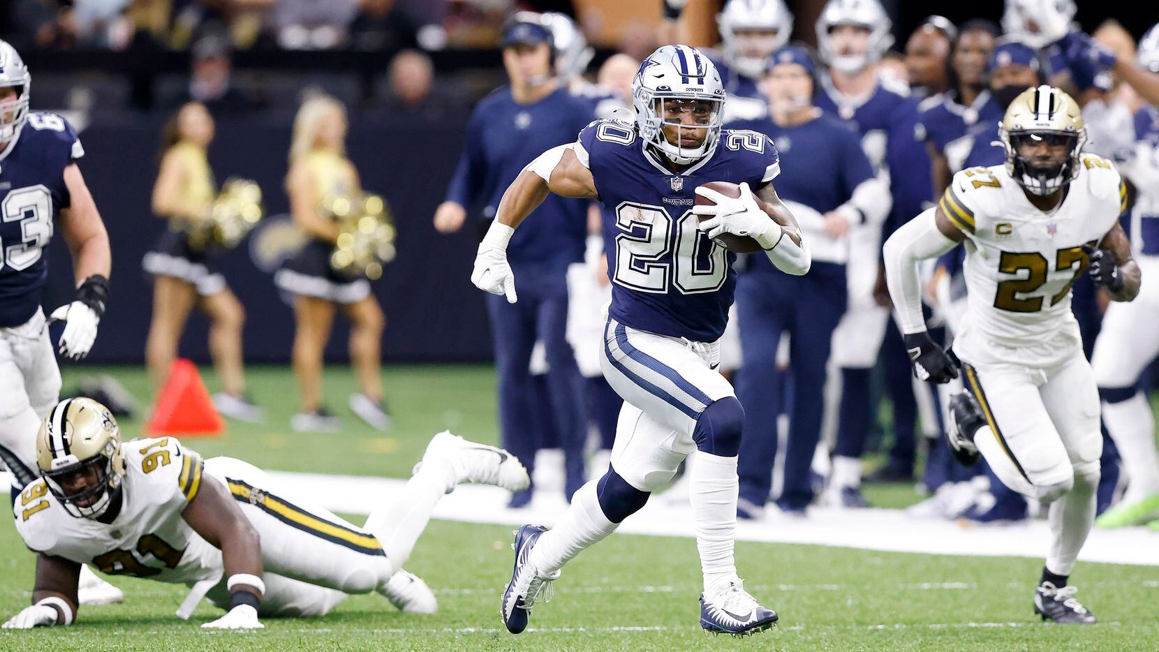 Dallas Cowboys running back Tony Pollard (20) breaks away from New Orleans Saints defensive tackle Josiah Bronson (91) enroute to a long touchdown run in the third quarter at the Caesars Superdome in New Orleans, Louisiana December 2, 2021. The Cowboys won 27-17.