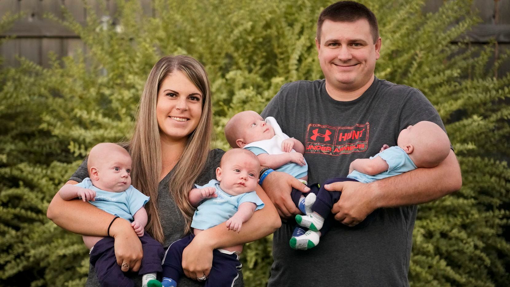 Katie and Chris Sturm with their quadruplets, from left, Daniel, Austin, Hudson and Jacob, who were born in July, photographed on Tuesday, Sept. 29, 2020, in Haslet, Texas. (Smiley N. Pool/The Dallas Morning News)
