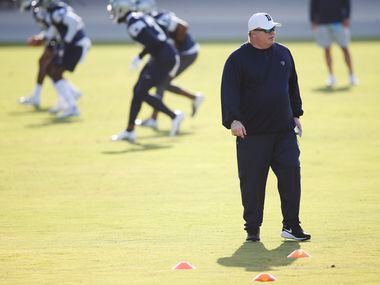 Dallas Cowboys head coach Mike McCarthy watches practice on the first day of training camp...