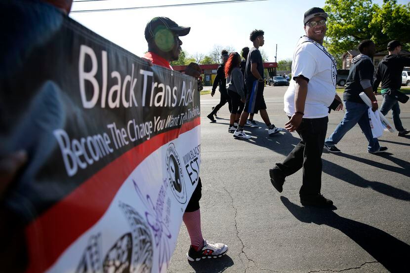 Trenton Johnson (far right), a transgender man, participates in the AIDS Walk South Dallas...