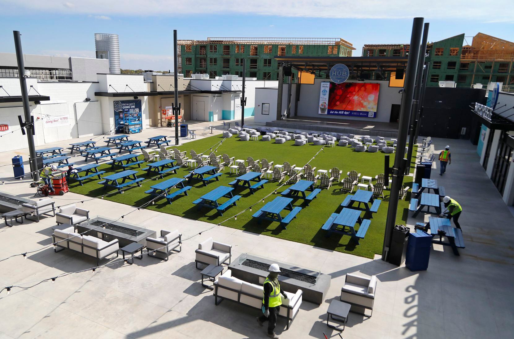 At The Hub in Allen, the restaurants and bars surround a turfed area near a stage.