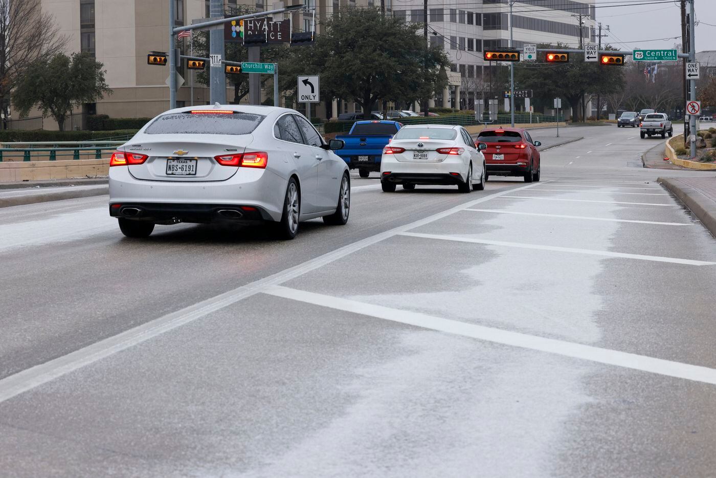 Sleet covers a bridge at Churchill Way and U.S. 75 in Dallas, Monday, Jan. 30, 2023. North...