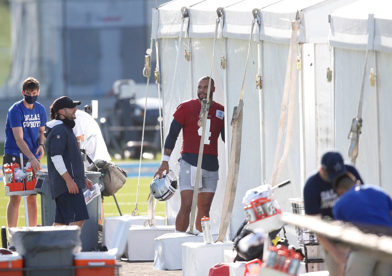 Dallas Cowboys quarterback Dak Prescott (4) makes his way into an air conditioned tent on...