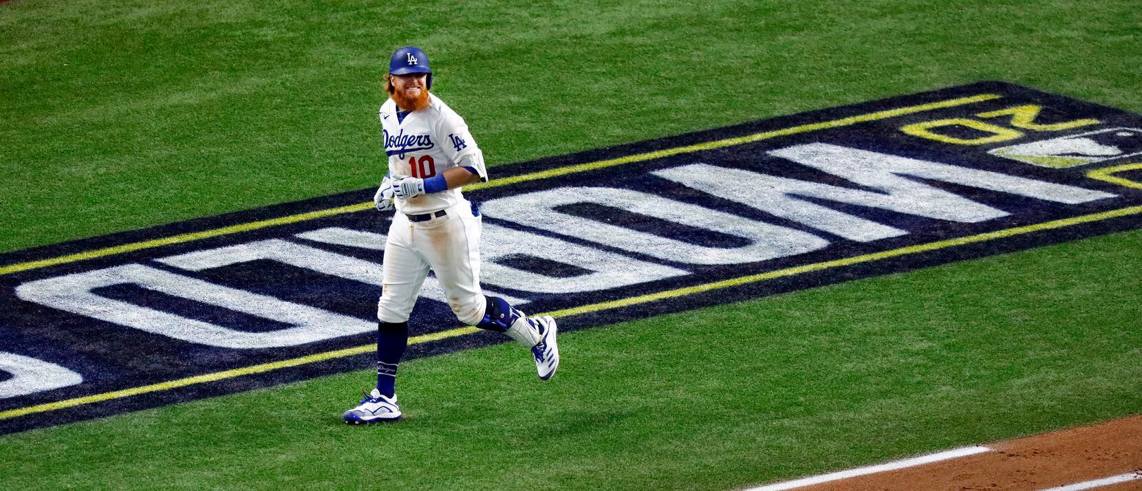 Los Angeles Dodgers third baseman Justin Turner (10) watches his sixth inning fly out to...