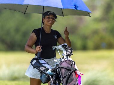 Hebron’s Morgan Horrell poses for the camera as she exits the 8th green during the 6A girls...