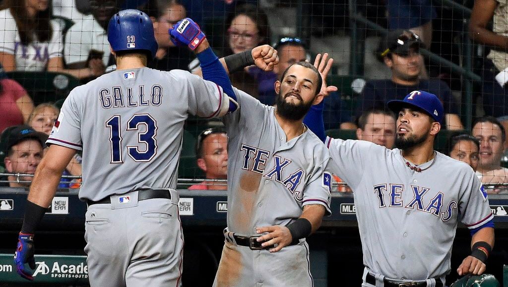 Texas Rangers' Joey Gallo (13) celebrates his solo home run off Houston Astros relief...