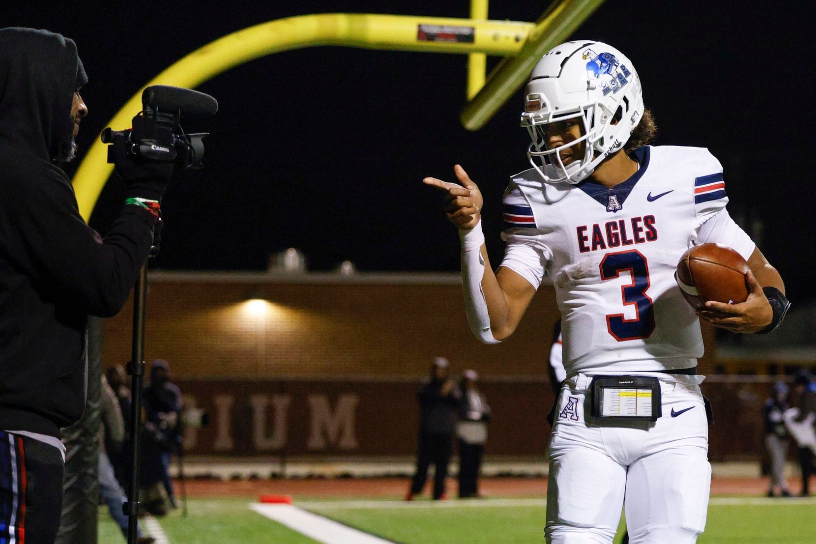 Allen quarterback Mike Hawkins (3) celebrates a touchdown during the first half of a Class...