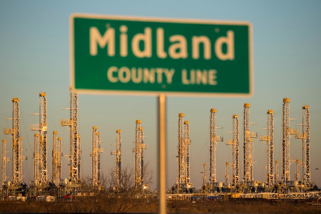 FILE photo shows oil rigs stacked for storage near Midland, Texas in the heart of Permian...