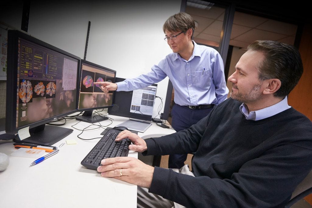 Dan Krawczyk, scientist and deputy director of the UT-Dallas Center for BrainHealth (right),...