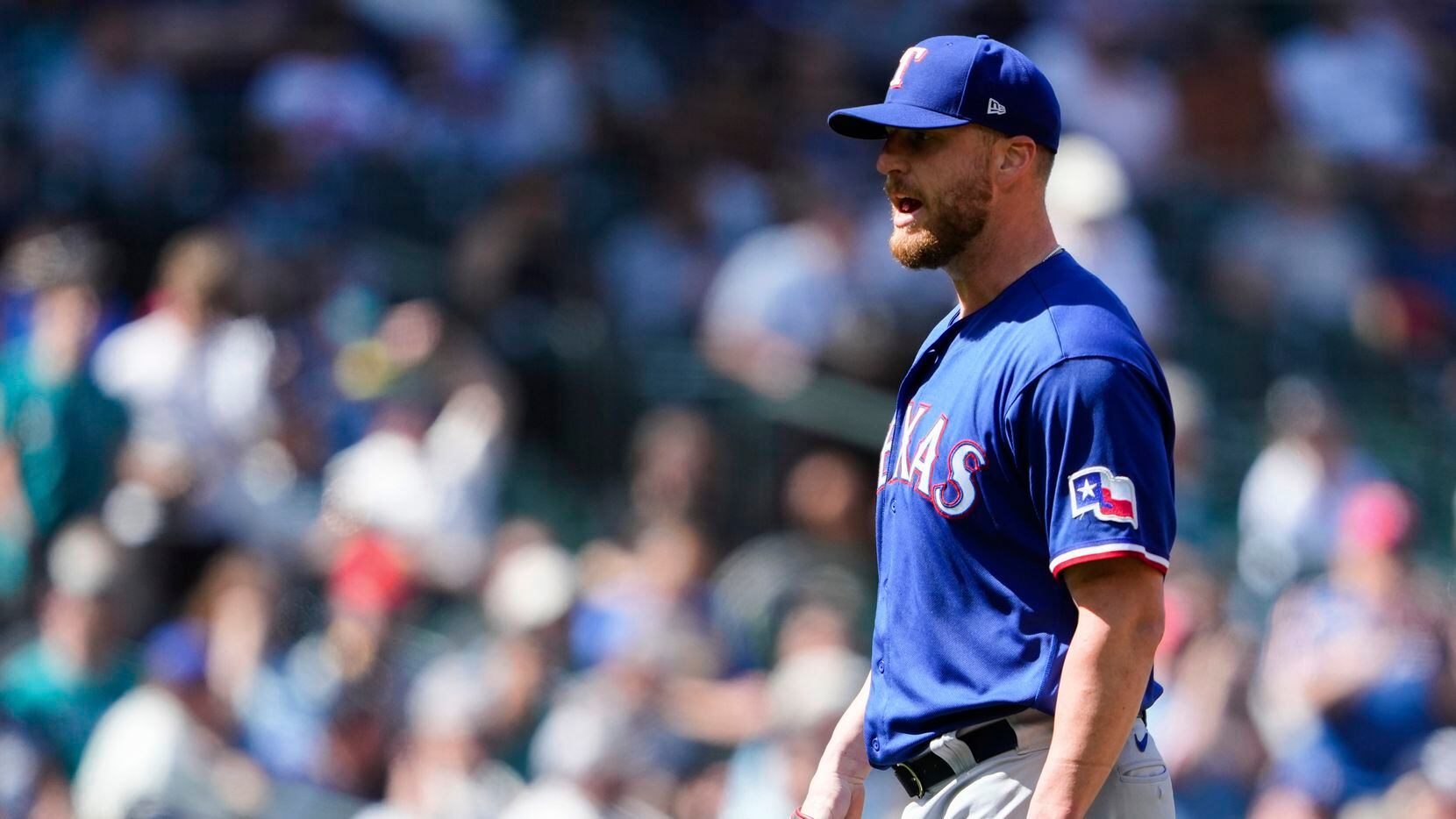Texas Rangers relief pitcher Will Smith stands near the mound after the Rangers defeated the...