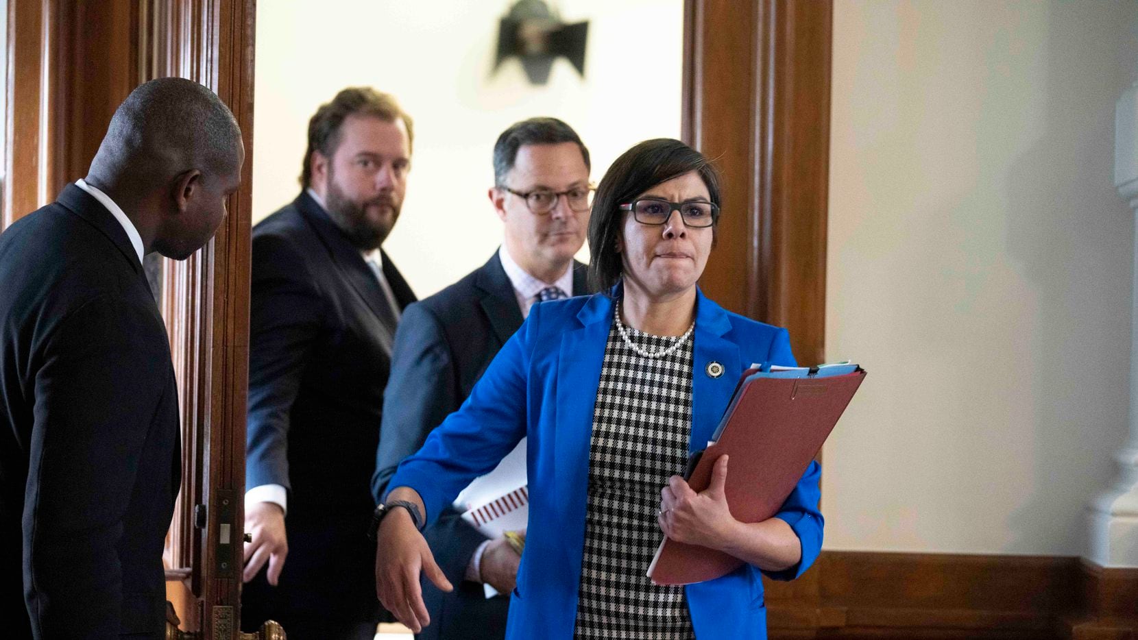 State Reps. John Bucy, D-Austin, Rafael Anchia, D-Dallas, and jessica Gonzalez, D-Dallas, leave a Democratic caucus meeting with the House Speaker Dade Phelan during negotiations on SB 7 the election reform bill on May 30, 2021. 