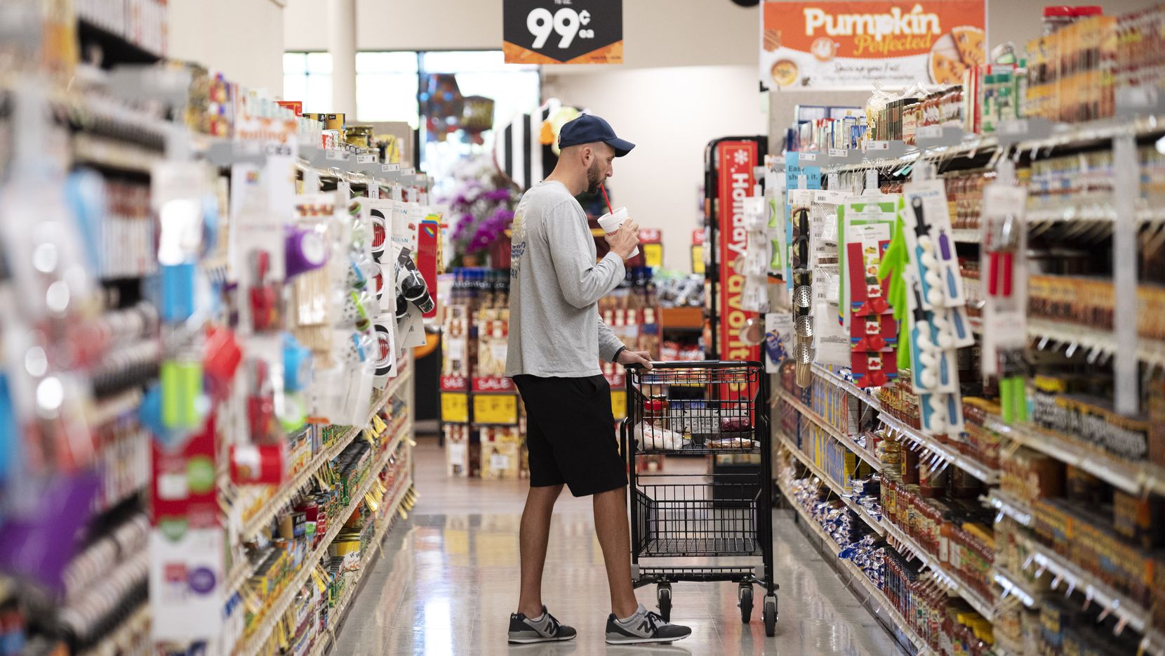 Brad Seaton shops for pasta and sauce inside the Tom Thumb supermarket at Custer Parkway in...