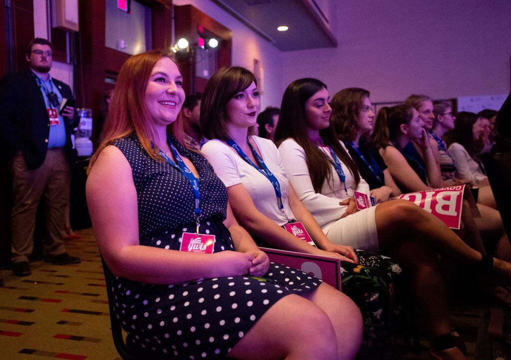 Heather Young (left) and Kylee Taylor, both from the University of Toledo, listen to conservative political commentator Dana Loesch speak at the Turning Point USA Young Women's Leadership Summit, a conference for young conservative women, on Thursday, June 14, 2018, at the Hyatt Regency hotel at DFW International Airport, Texas. 