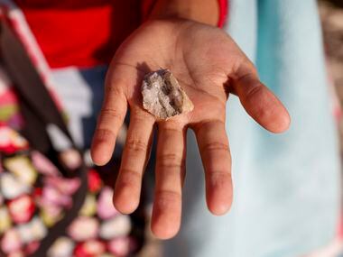 Catalina Koontz, 7, shows off a piece of quartz she found on the Ladd property in...