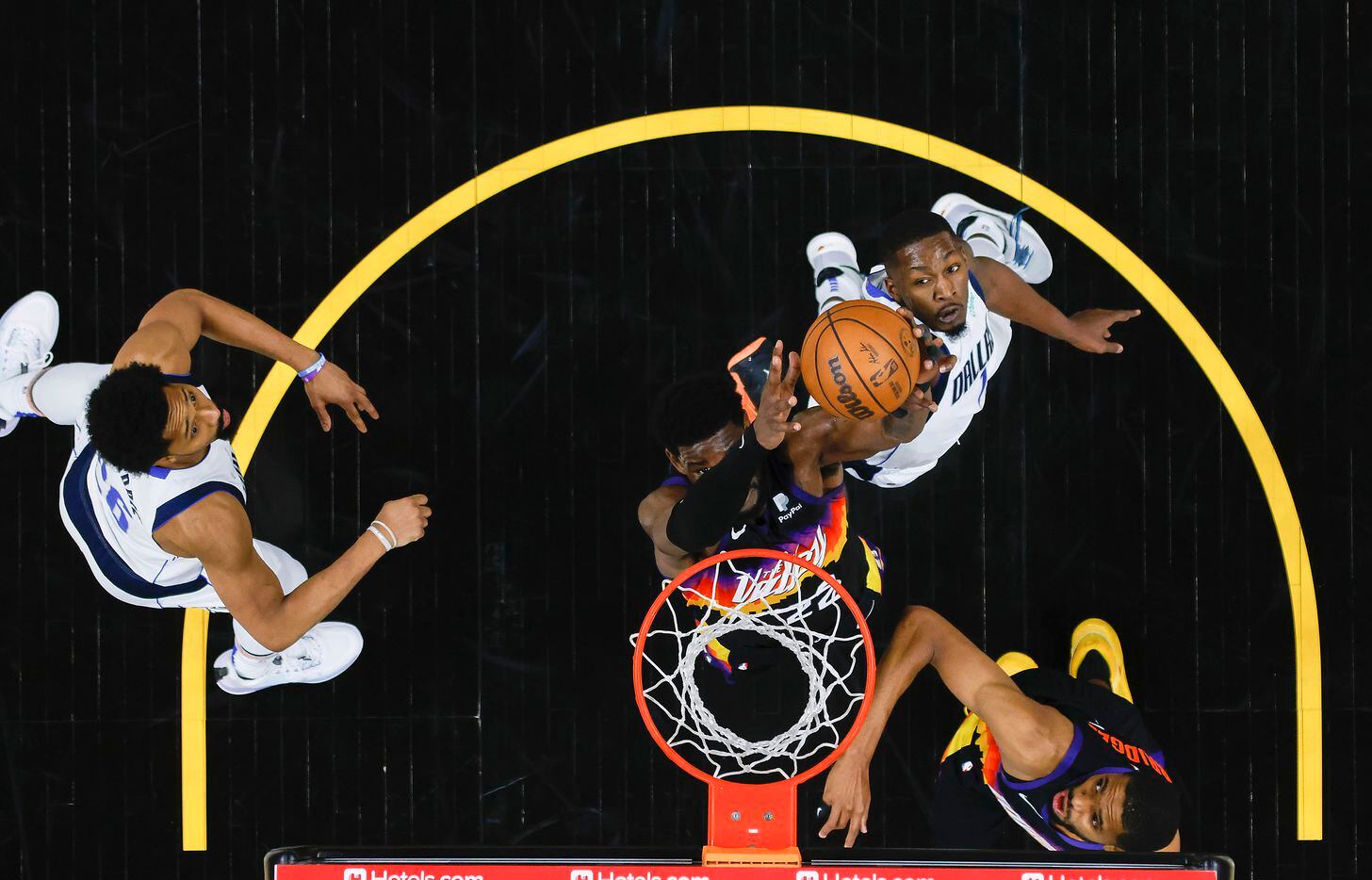Phoenix Suns center Deandre Ayton (22) scores past Dallas Mavericks forward Dorian...