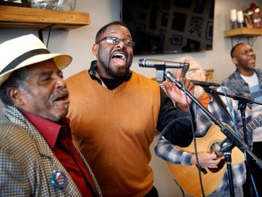Ronnie Mays (left) and Gerry West sing during the weekly Bible study session at Smokey...