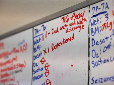 A white board hanging in Charlotte Brooks’ room details her health during home aide shifts...