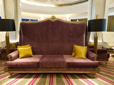 A purple couch graces the lobby at The Guest House at Graceland, the recently opened resort...