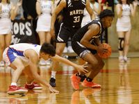 Arlington Martin’s Kordelius Jefferson (23), right, steals the ball from El Paso American’s...