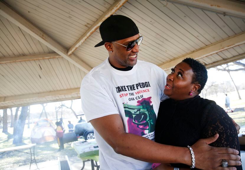 Derrick Battie greeted Katrina Clark during a "Stop the Violence Oak Cliff" picnic at...