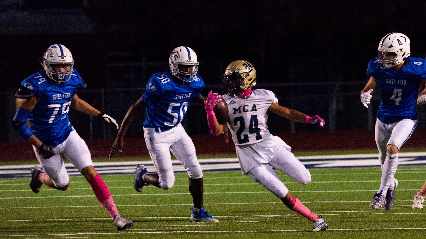 McKinney Christian's Noah Wheeler (No. 24) evades defenders on a kickoff return during a...