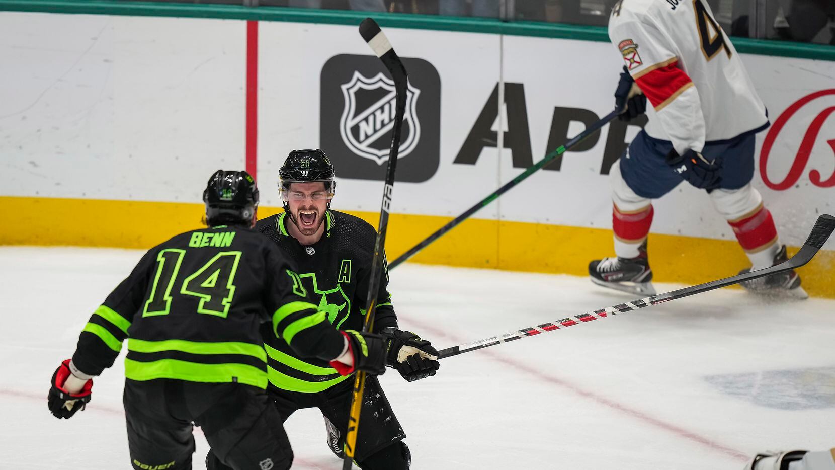Dallas Stars center Tyler Seguin (91) celebrates with left wing Jamie Benn (14) after scoring during the second period of an NHL hockey game against the Florida Panthers at the American Airlines Center on Thursday, Jan. 6, 2022, in Dallas. (Smiley N. Pool/The Dallas Morning News)