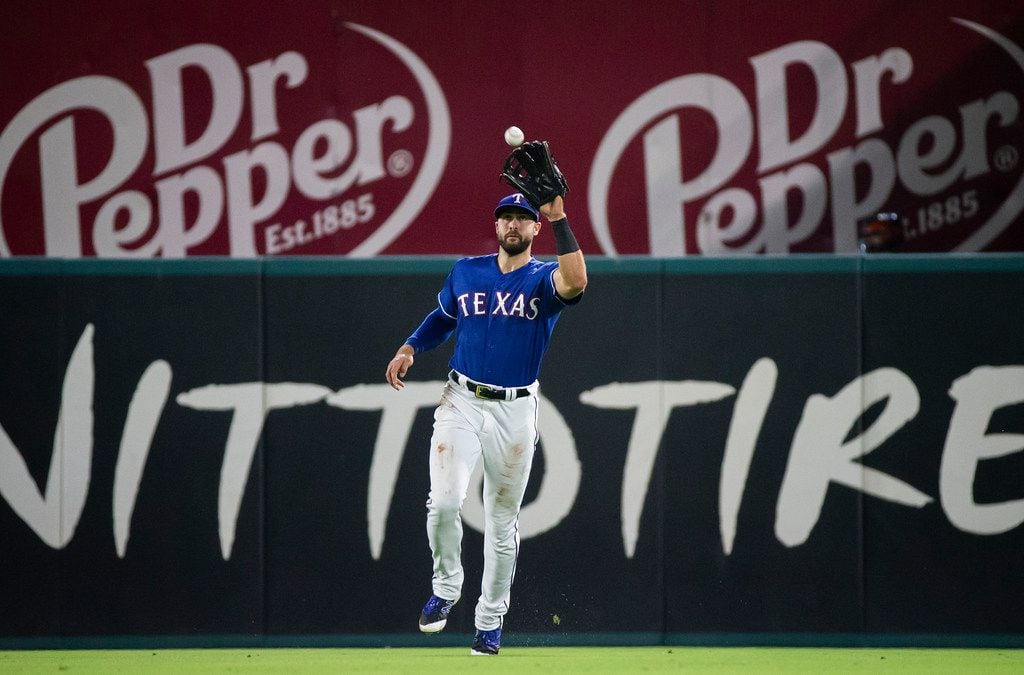 FILE - Texas Rangers center fielder Joey Gallo makes the catch on a line drive by Houston...