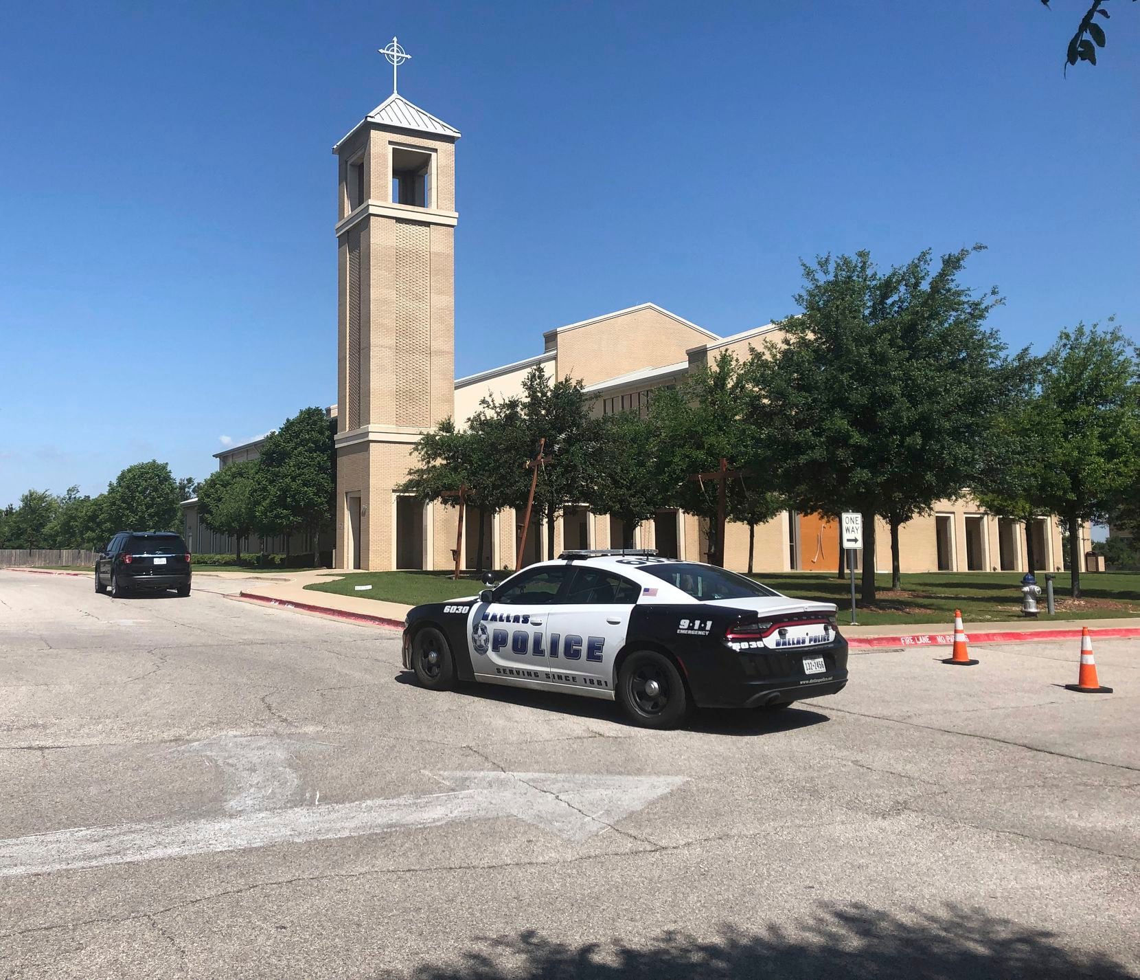 A police car was parked outside St. Cecilia Catholic Church on Wednesday.