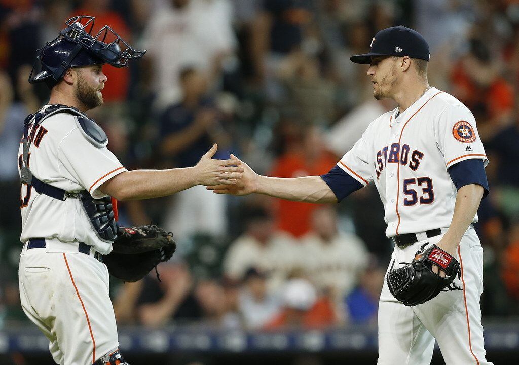HOUSTON, TX - MAY 23:  Ken Giles #53 of the Houston Astros shakes hands with Brian McCann...