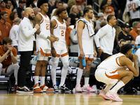 Texas watches during their loss against Miami in an Elite 8 college basketball game in the...