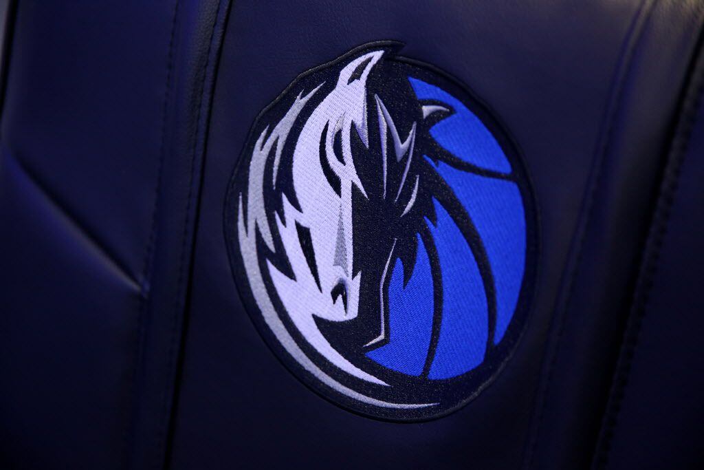 The Dallas Mavericks logo is printed on a chair inside the Dallas Mavericks locker room at...