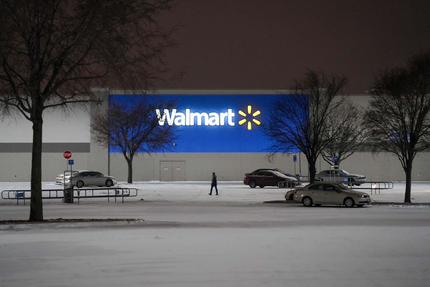 The parking lot of a Walmart Store on Coit Road empties as a second winter storm brought...