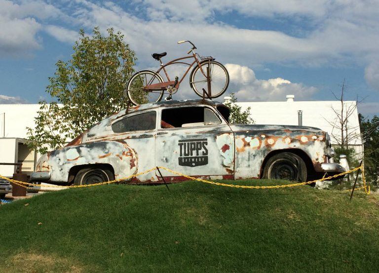 An old car sets the tone for funky Tupps Brewery, in McKinney's Cotton Mill area.