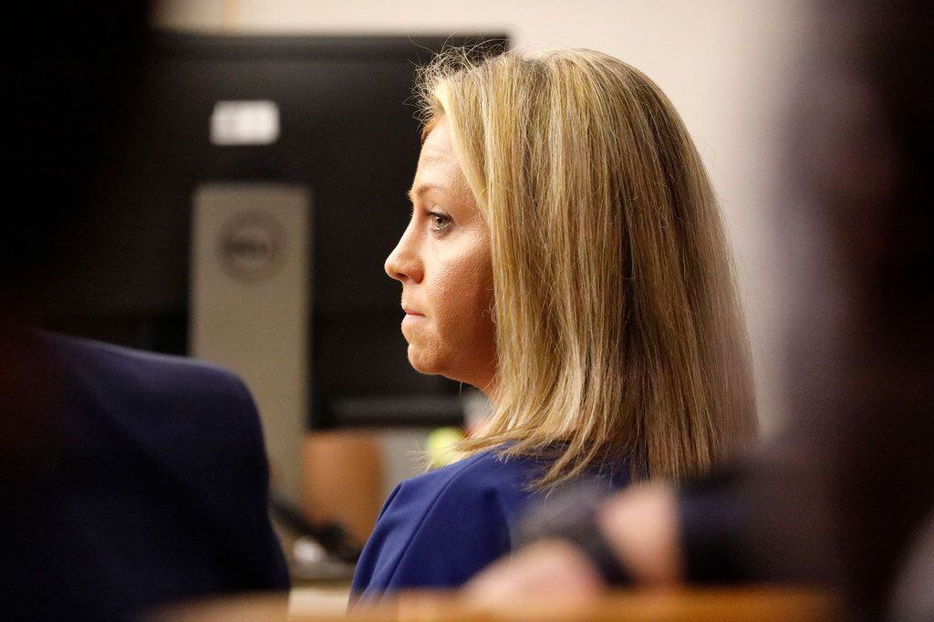 Fired Dallas police Officer Amber Guyger listens to her former police partner testify on the...