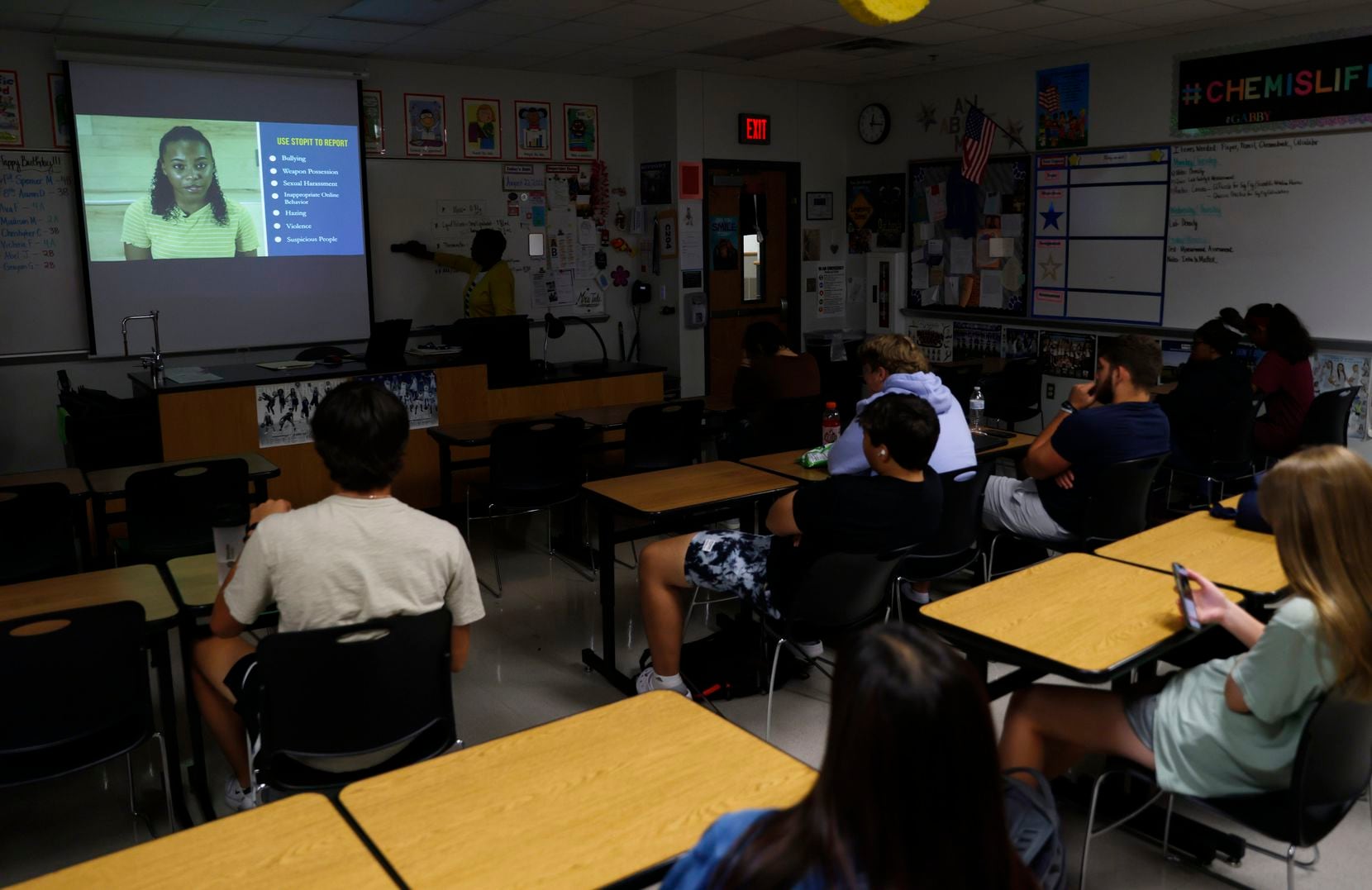 Students watch as a video is played during a STOPit presentation at Frisco Lone Star High...