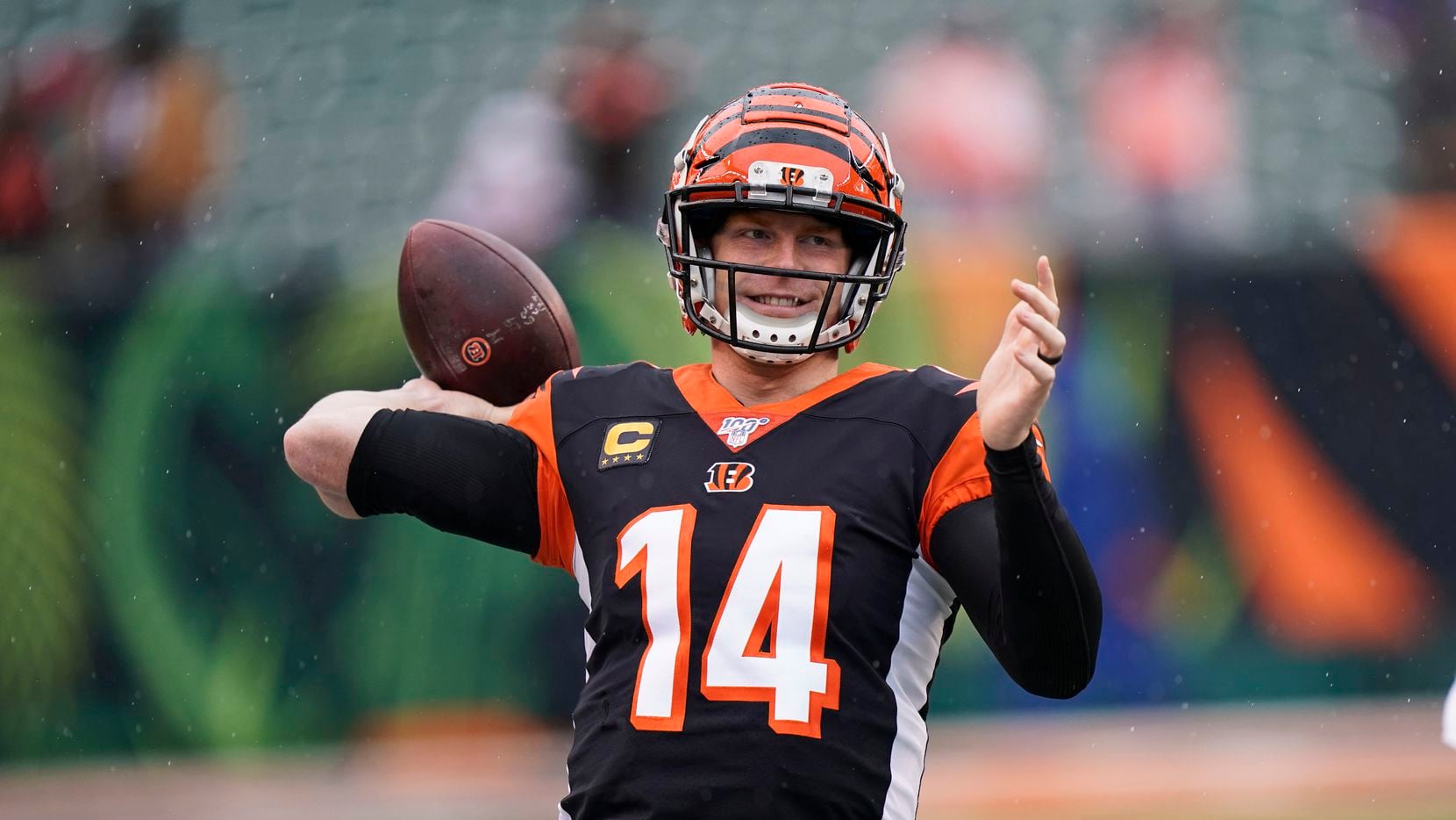 FILE - Bengals quarterback Andy Dalton warms up before a game against the Browns on Sunday,...